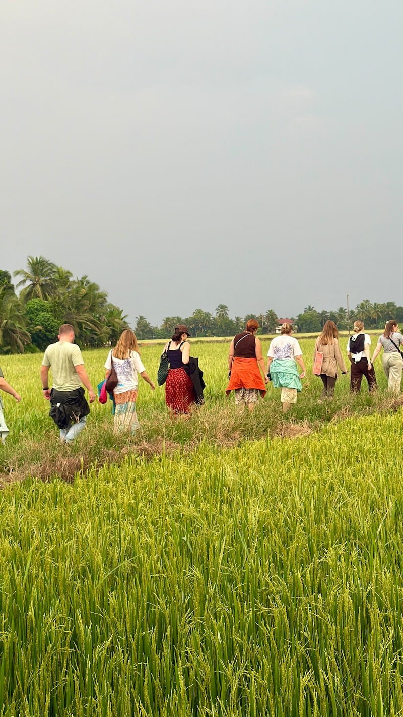 Onda group on a village walk with a local family in South India